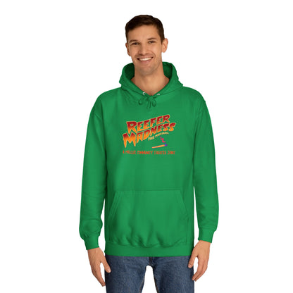 Introducing the "Reefer Madness - A Miller Community Theatre Joint" hoodie by Printify—a green hoodie with "Reefer Madness The Musical" displayed in bold, colorful font. Beneath it, the phrase "A very scary trip!" is featured. This hoodie is ideal for fans of the Miller Community Theatre production and comes with a front pocket and a drawstring hood.