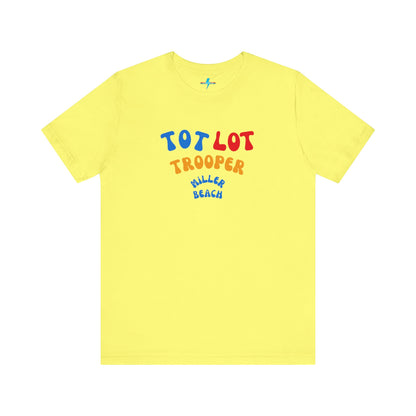 A green unisex jersey short sleeve tee from Printify, featuring colorful text on the front that reads "TOT LOT TROOPER MILLER BEACH" in blue, red, yellow, and orange letters. The shirt is displayed against a plain white background.