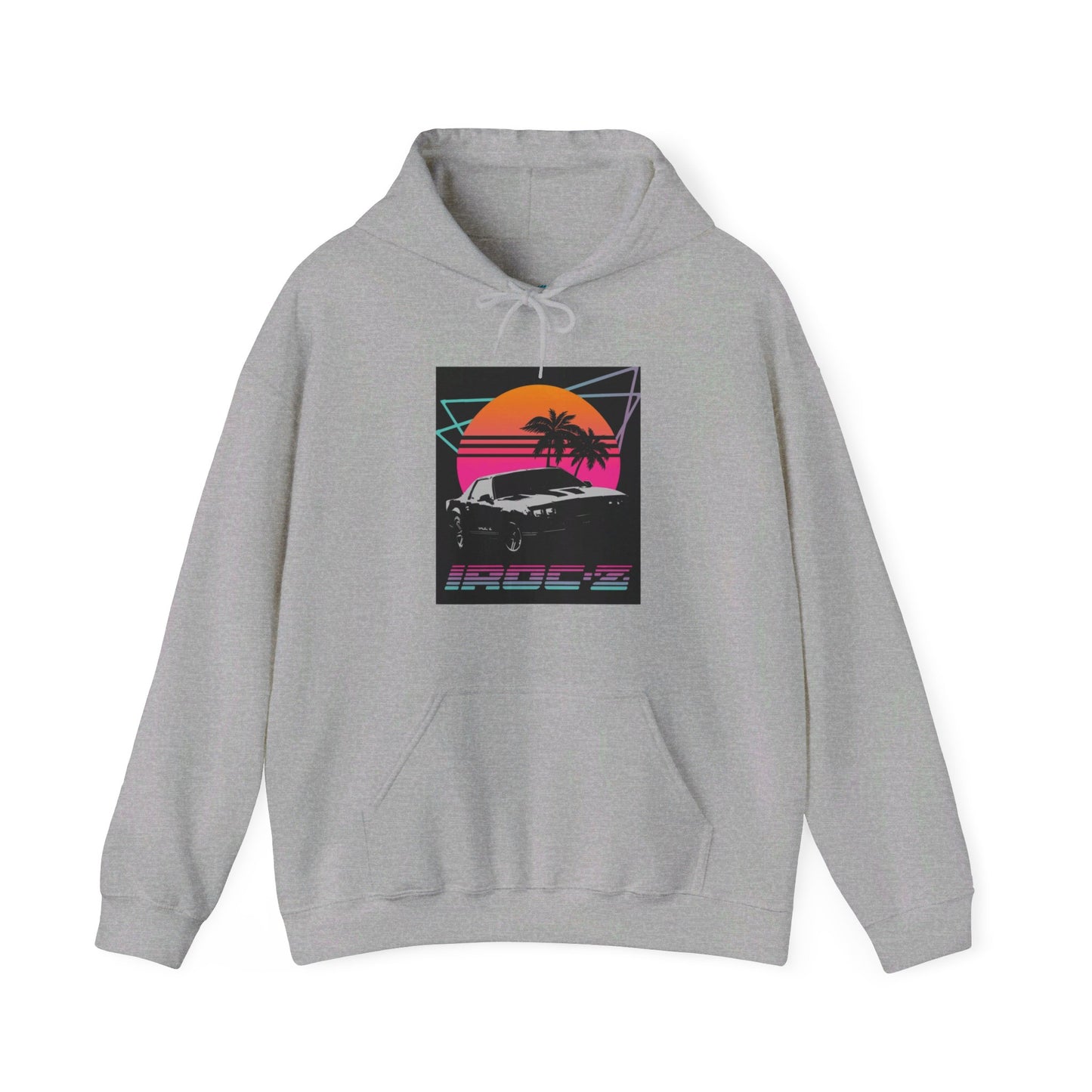 Introducing the Chevrolet IRoc Z28 - 1980s Retro Hoodie by Printify: This vibrant pink hoodie showcases a striking retro design on the front, featuring a classic American muscle car set against an orange and red sunset with palm trees, intersected by geometric shapes. The text "IROCZ" is prominently displayed below the image. Offering a relaxed fit and equipped with a front pocket, this hoodie perfectly captures the essence of 1980s style.