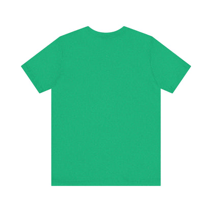 A light blue Printify "The Tinder Box 1980s" unisex jersey short sleeve tee featuring the "Tinder Box" logo in the center. The logo consists of a dark shield with the words "Tinder Box" in white text, with a small flame icon replacing the dot above the "i".