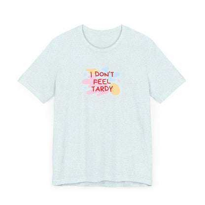 The "I Don't Feel Tardy - 1980s Retro - Unisex Jersey Short Sleeve Tee" from Printify is a light pink jersey shirt that features the bold, colorful text "I DON'T FEEL TARDY" prominently at its center. This design exudes retro vibes with small star shapes and abstract splashes of blue, yellow, and pink, laid flat against a plain background to channel pure Van Halen T-shirt energy.