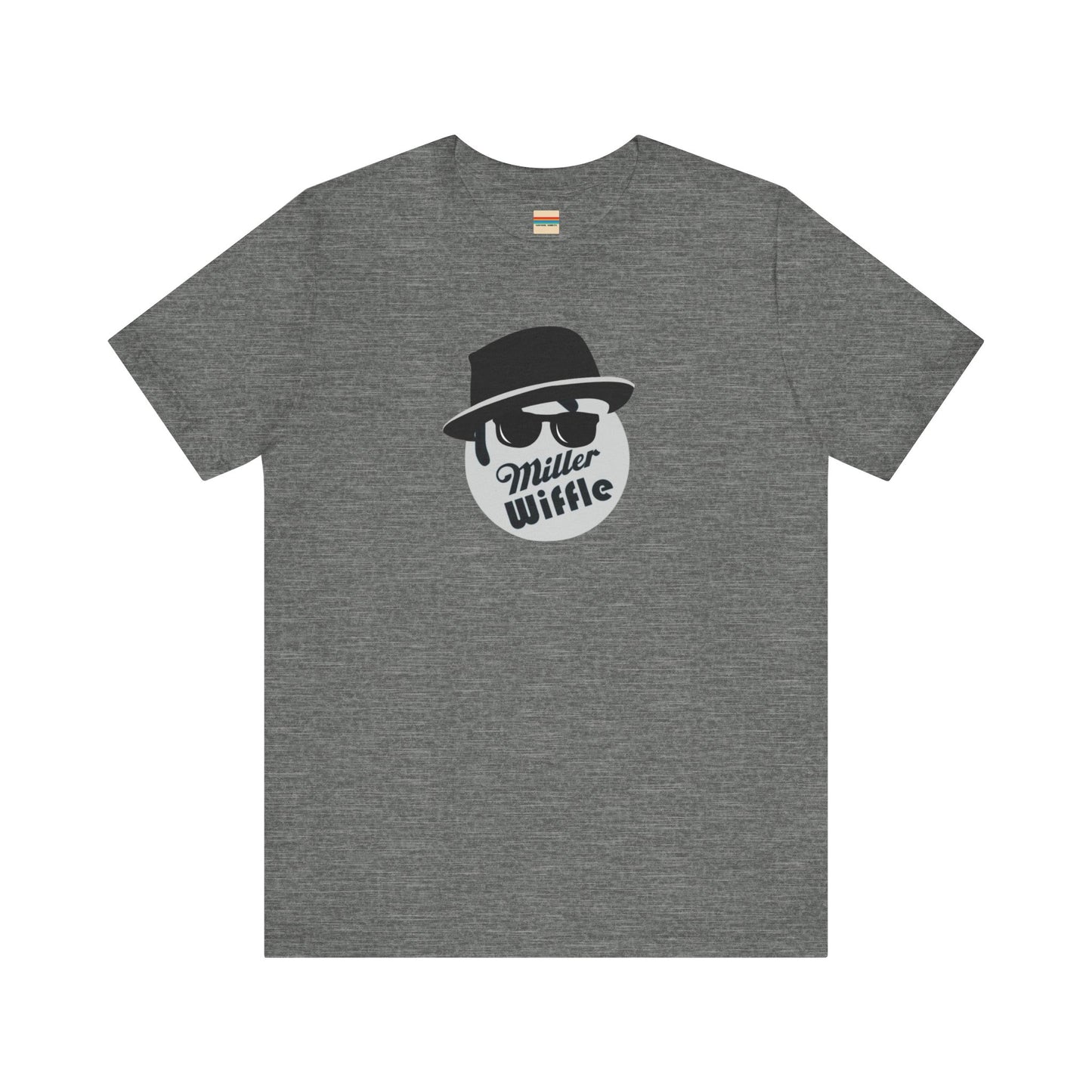 A purple unisex jersey tee from Printify, named the "Miller Wiffel Ball - Blues Brothers - Unisex Jersey Short Sleeve Tee," features a stylized graphic of a ball wearing a black fedora and sunglasses with the text "Miller Wiffel" below it. Another identical soft cotton t-shirt is neatly folded underneath, highlighting its breathable fabric.