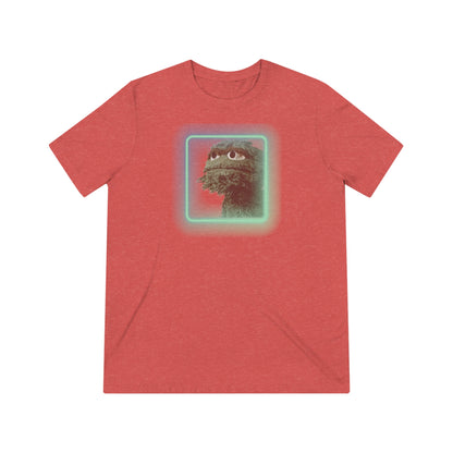 Introducing the Oscar the Grouch Unisex Triblend Tee by Printify: This red triblend t-shirt features a green puppet character with expressive eyes, framed by a glowing, square-shaped rainbow border. With its simple and casual design, free of any additional text or graphics, this tee offers the perfect blend of style and durability thanks to its polyester construction.