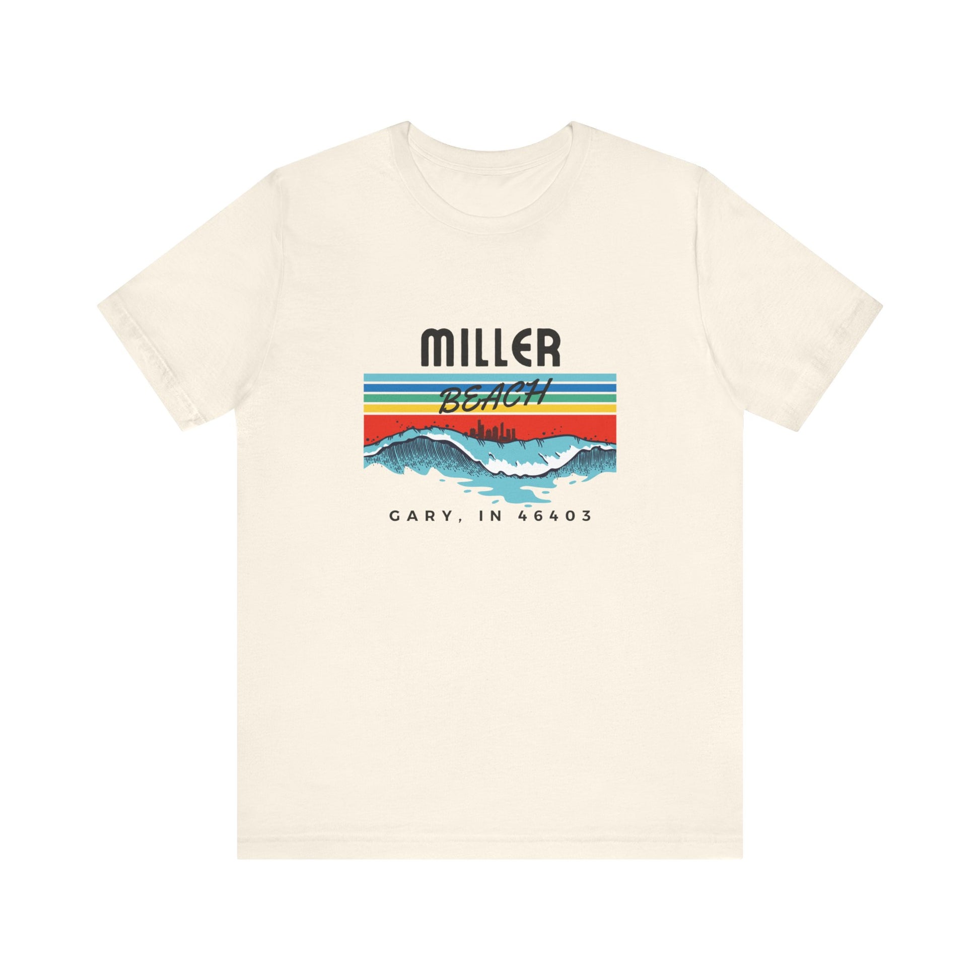 The Miller Beach 46403 Surf Style - Unisex Jersey Short Sleeve Tee by Printify features a retro surf-inspired design on a yellow background. The shirt displays "MILLER BEACH" above waves with a skyline illustration, while "Cary, IN 46403" is printed below the waves. The vibrant design also includes colorful stripes in shades of blue, red, and orange.