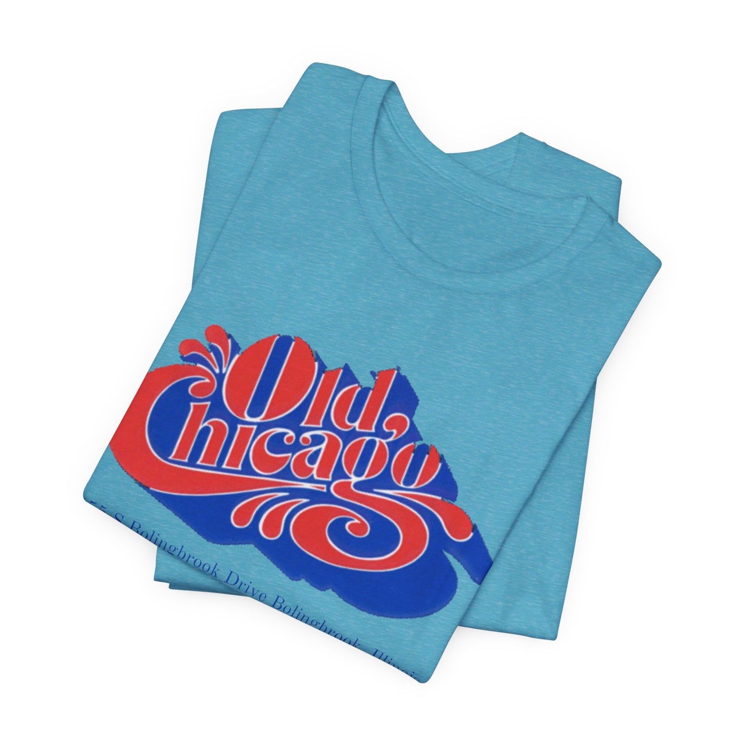 The "Old Chicago Mall Bolingbrook 1980s Retro - Unisex Jersey Short Sleeve Tee" from Printify is a gray T-shirt showcasing a vintage design with the text "Old Chicago" in blue and red. Beneath the main text, the address "355 S. Bolingbrook Drive, Bolingbrook, Illinois" appears in smaller font, evoking 80s nostalgia of the Old Chicago Mall. The shirt is displayed against a white background.