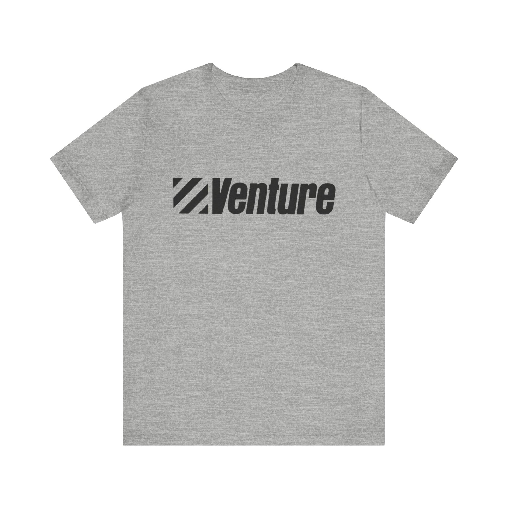 A unisex jersey short sleeve tee from Printify, featuring a classic 1980s Venture Stores logo printed in bold black letters across the chest on a gray fabric, is showcased against a plain white background.