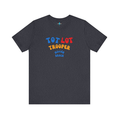 A green unisex jersey short sleeve tee from Printify, featuring colorful text on the front that reads "TOT LOT TROOPER MILLER BEACH" in blue, red, yellow, and orange letters. The shirt is displayed against a plain white background.