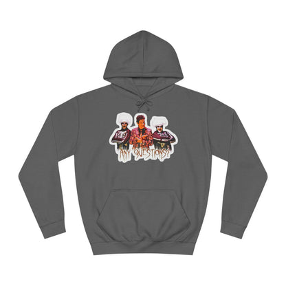 The David S Pumpkins - Any Questions? - Halloween Unisex College Hoodie by Printify is a brown sweatshirt showcasing an illustration of three people. The central figure has red hair, sports a colorful ensemble, and emanates a Halloween vibe, with two flanking figures who have white hair and wear dark attire. Beneath the trio is the phrase "Any Questions?