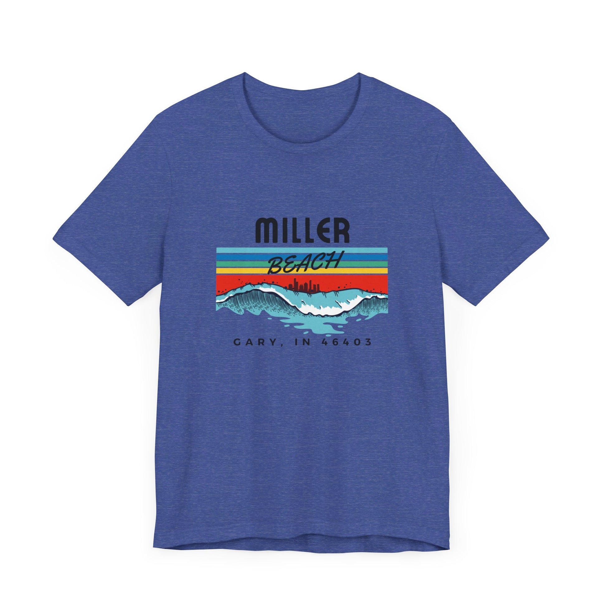 The Miller Beach 46403 Surf Style - Unisex Jersey Short Sleeve Tee by Printify features a retro surf-inspired design on a yellow background. The shirt displays "MILLER BEACH" above waves with a skyline illustration, while "Cary, IN 46403" is printed below the waves. The vibrant design also includes colorful stripes in shades of blue, red, and orange.