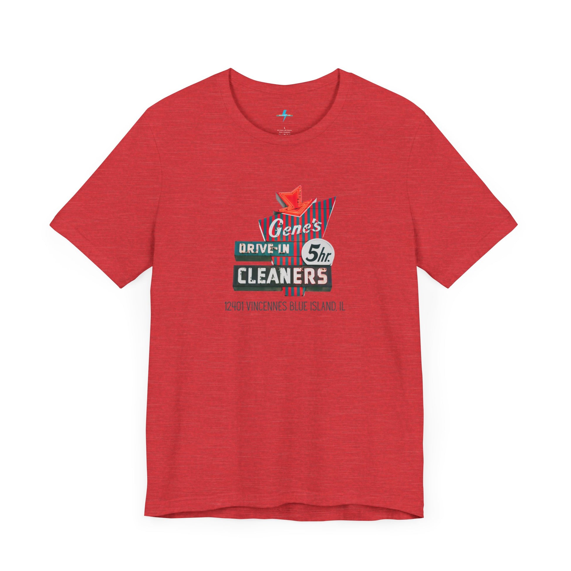 A unisex Jersey short sleeve tee from Printify featuring a light grey color with a retro-style graphic in the center. The design showcases text that reads "Gene's Drive In Cleaners, 5th," along with the address "12401 Vincennes Blue Island IL" in a blend of vintage fonts and colors, evoking the classic Chicago Fire-era vintage sign aesthetic.