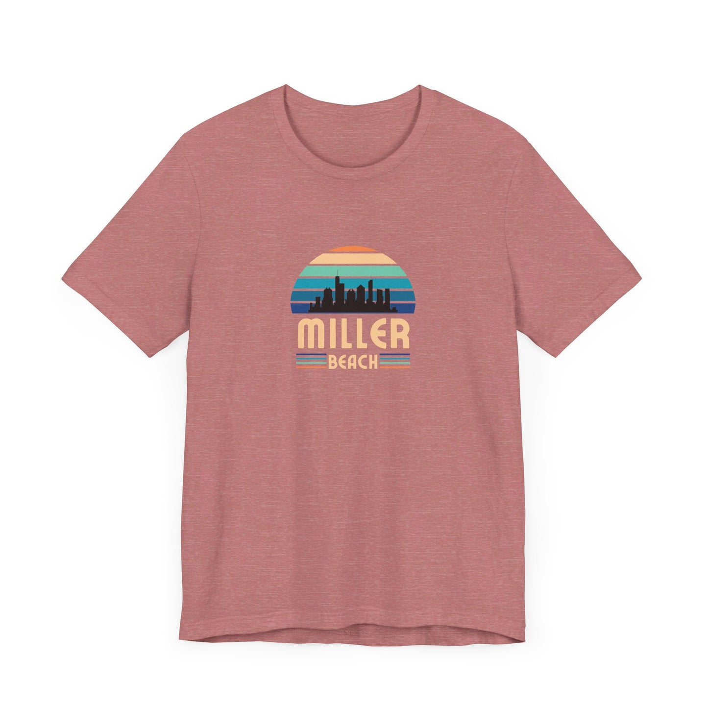 A brown unisex jersey short sleeve tee called "Miller Beach Chicago Skyline" from Printify features a vintage-style design with a sunset, the Chicago skyline, and "Miller Beach" in bold letters. The design incorporates shades of blue, orange, and yellow and is displayed against a plain white background.