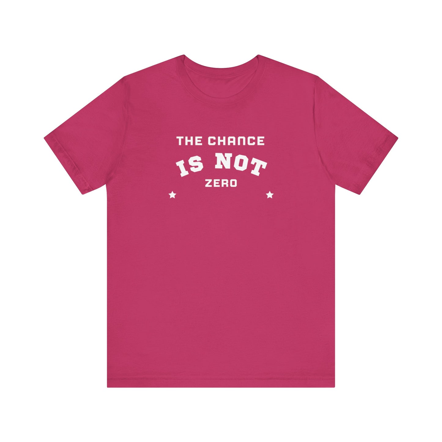 Folded light red Unisex Jersey Short Sleeve Tee from Printify, featuring bold white text that reads "THE CHANCE IS NOT ZERO" along with two star illustrations. This motivational T-shirt, made from breathable fabric, is neatly stacked with another identical shirt underneath.