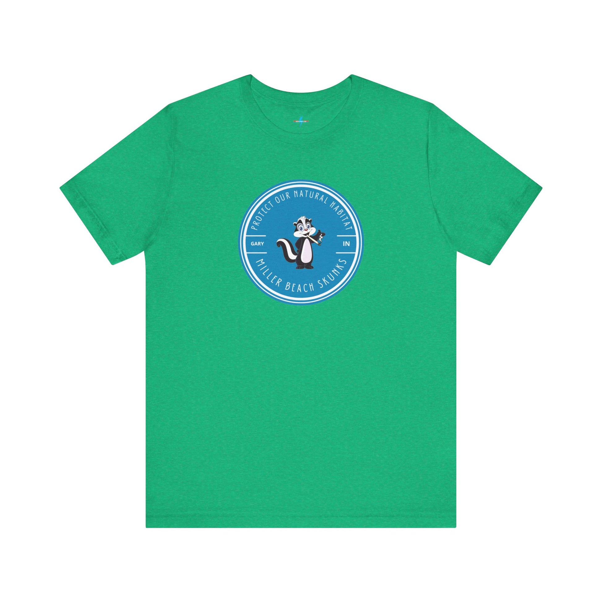 The Printify Miller Beach Skunks - Unisex Jersey Short Sleeve Tee is a gray T-shirt that features a circular blue logo at the center. Inside the logo, there is an illustration of a skunk with the text "Protect Our Habitat" and "Miller Beach Skunks" around the border, promoting environmental consciousness. The upper left part of the logo reads "Gary, IN.