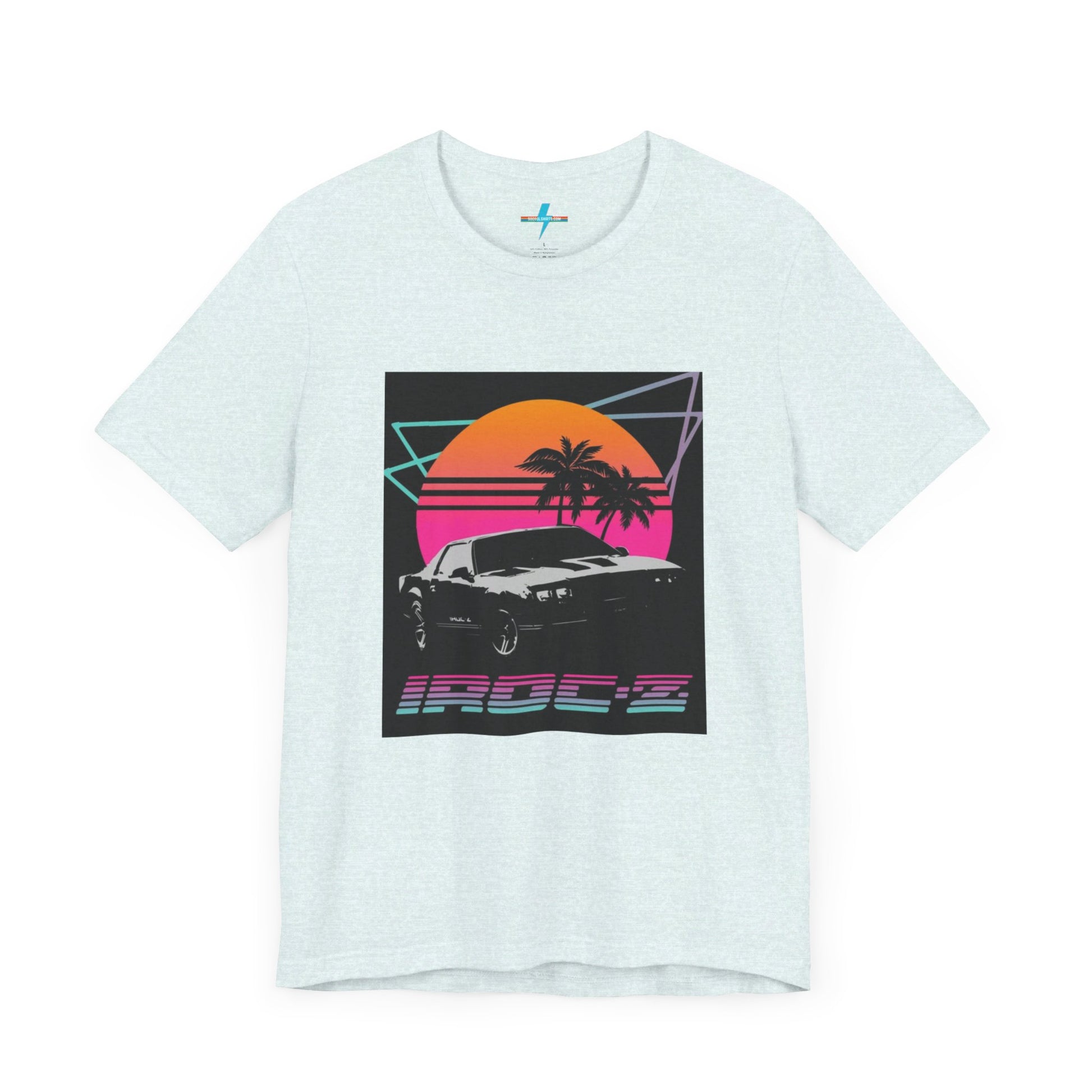 A Chevrolet Camaro iRoc Z Z28 T-Shirt 1980's by Printify, featuring a retro design with a black car, palm trees, and a sun setting in the background. The design includes geometric lines in neon colors and the text "IROC-Z" at the bottom, perfect for fans of the 1980s Chevy Camaro.