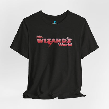 A purple Mr. Wizard's World T-shirt from Printify, featuring bold gradient red and white text with a lightning bolt through the letter "A" in "Wizard." Ideal for science enthusiasts and fans of the iconic 1980s Nickelodeon show, this unisex jersey short sleeve tee is displayed against a plain white background.