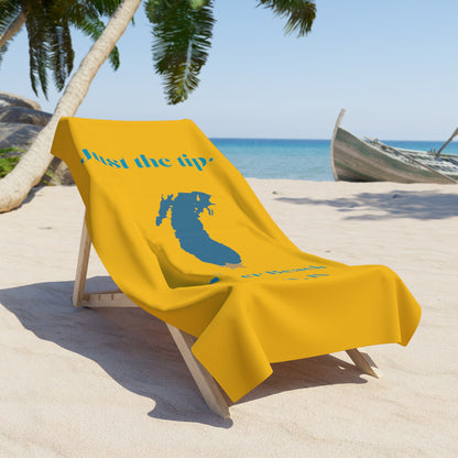 The Printify "Just the Tip - Miller Beach" towel is luxuriously soft and brightly yellow, featuring a blue silhouette of a woman's head with long hair adorned with a crown-like star. The sides are printed in blue with the text "Just the Tip" and "Miller Beach Gary, IN.