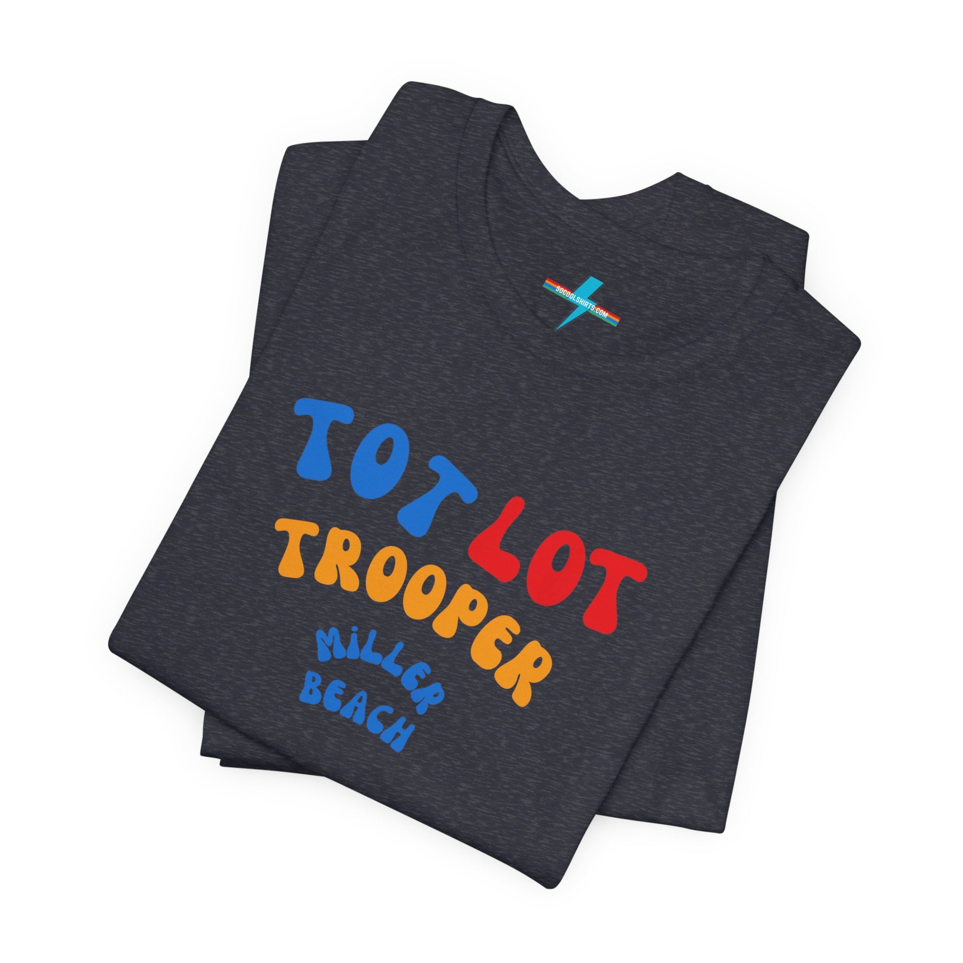 A green unisex jersey short sleeve tee from Printify, featuring colorful text on the front that reads "TOT LOT TROOPER MILLER BEACH" in blue, red, yellow, and orange letters. The shirt is displayed against a plain white background.