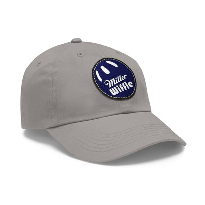 A gray dad hat by Printify, crafted from bio-washed chino twill, featuring a circular blue and white leather patch on the front. The patch showcases a baseball design with "Miller Wiffle" written in cursive font.