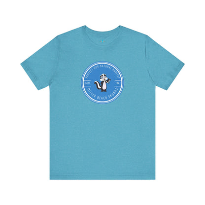 The Printify Miller Beach Skunks - Unisex Jersey Short Sleeve Tee is a gray T-shirt that features a circular blue logo at the center. Inside the logo, there is an illustration of a skunk with the text "Protect Our Habitat" and "Miller Beach Skunks" around the border, promoting environmental consciousness. The upper left part of the logo reads "Gary, IN.