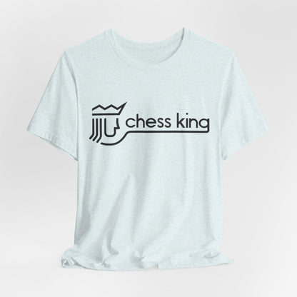 A unisex jersey short sleeve tee from Printify, featuring the Chess King 1980's Clothing Store Logo with a black, stylized king chess piece and the words "Chess King" on a blue background, reminiscent of retro 80s fashion.