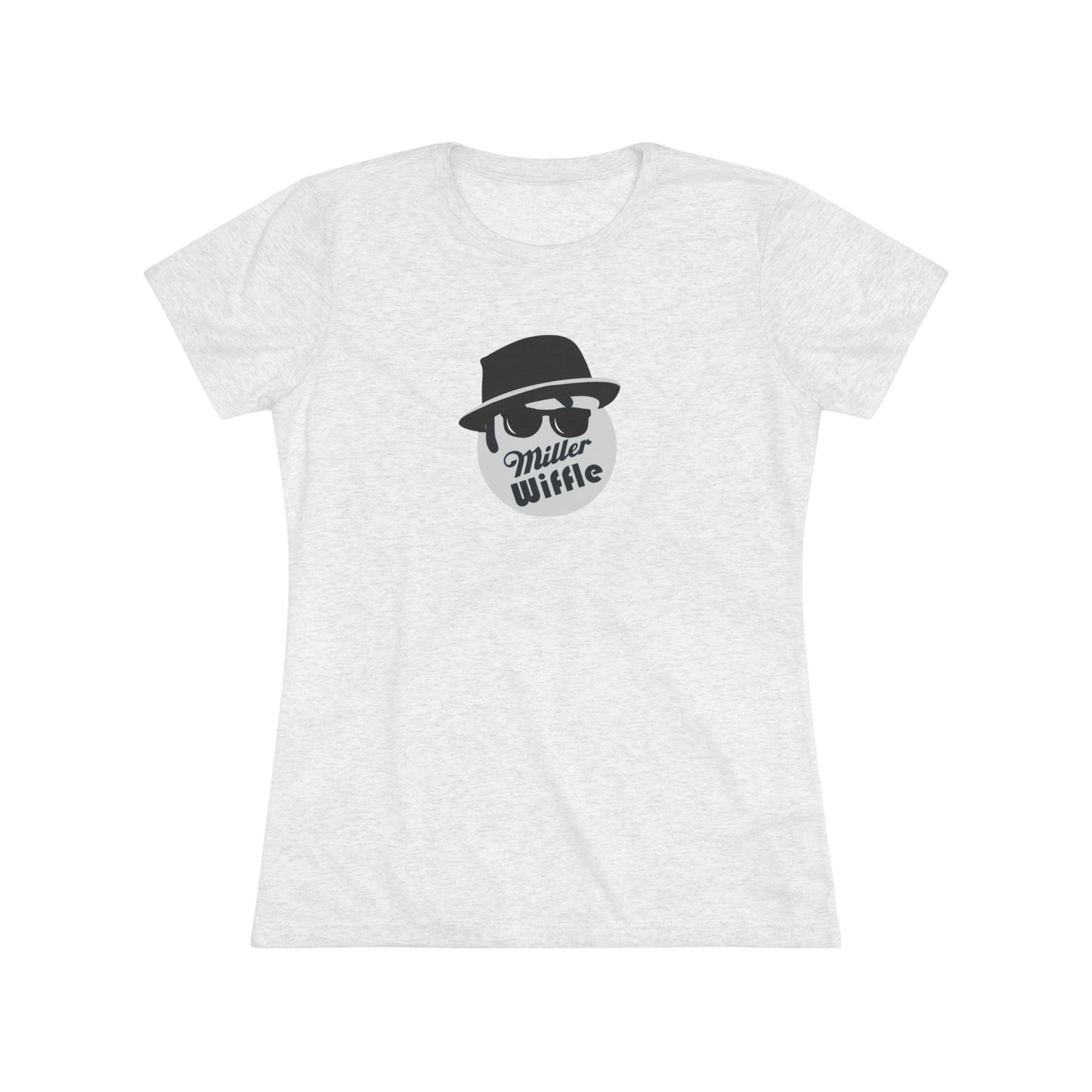 A cozy red t-shirt, the Miller Wiffel Ball - Blues Brothers - Women's Triblend Tee by Printify, features a graphic of a masked face wearing a fedora hat and sunglasses, along with the text "Miller Wiffle." The t-shirt is displayed on a wooden floor, paired with a denim jacket, white sneakers, and a potted green plant to create a vintage look.