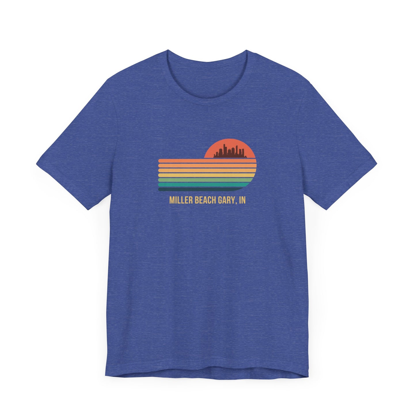 Introducing the Miller Beach Gary, IN Sunset Gradient - Unisex Jersey Short Sleeve Tee by Printify. This stylish blue T-shirt features a circular sunset graphic on the chest, showcasing a black city skyline silhouette against an orange-red sunset with horizontal stripes in green, yellow, and orange. Below the graphic reads "MILLER BEACH GARY, IN." Crafted from soft cotton for extra beachy charm.