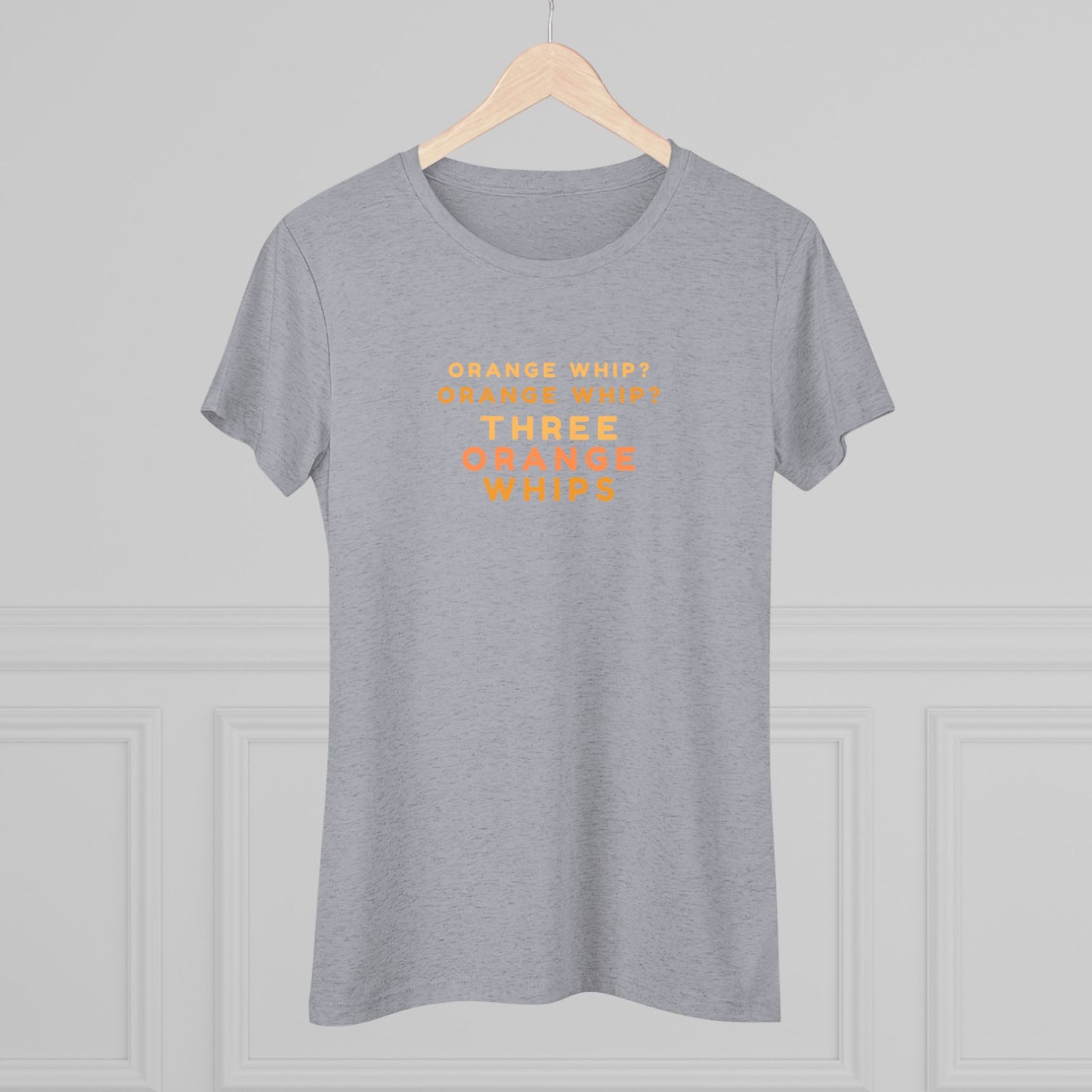 This Blues Brothers women's triblend tee from Printify features a dark gray vintage look with the text "ORANGE WHIP? ORANGE WHIP? THREE ORANGE WHIPS" printed in bright orange and yellow in the center. With a round neck and short sleeves, it's perfect for that retro vibe.