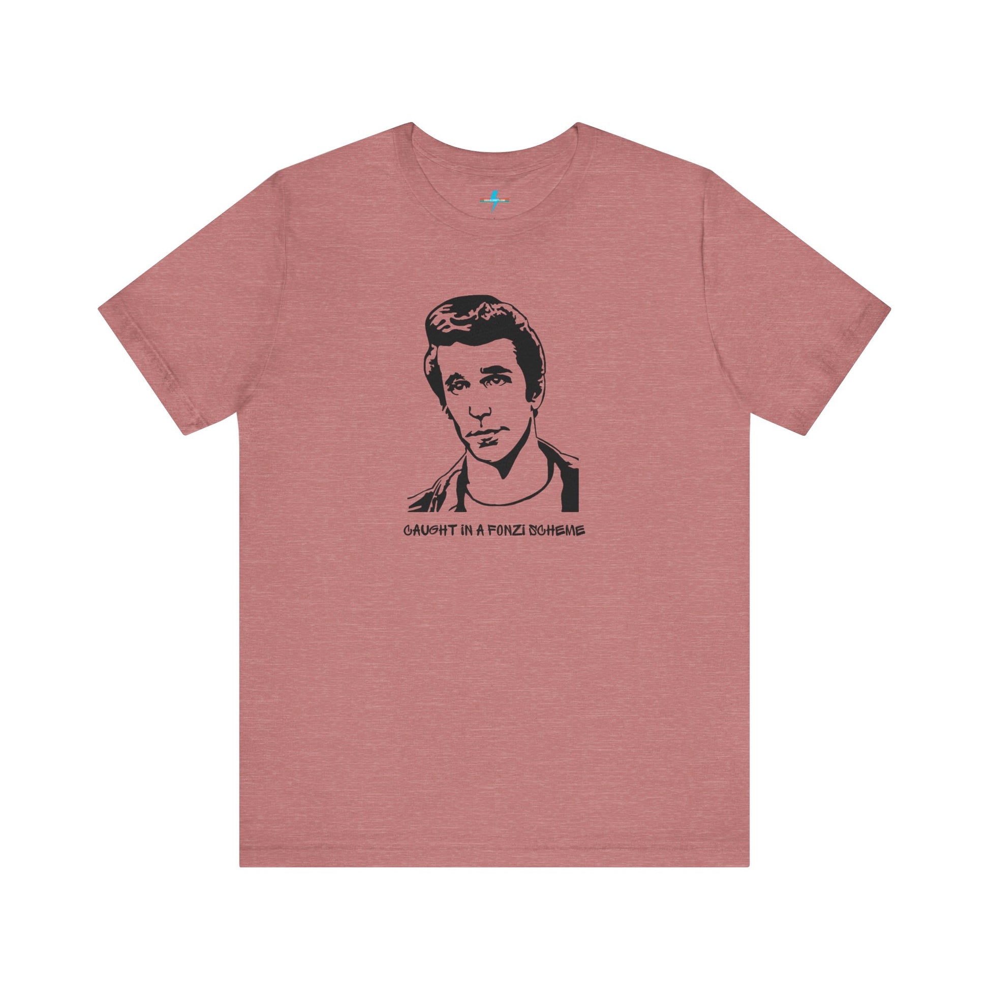 A white unisex jersey short sleeve tee by Printify, named "Caught in a Fonzi Scheme - Happy Days - Retro," features a black and white illustration of a person with a serious expression and styled hair, perfectly capturing the nostalgic apparel vibe. Below the illustration, the text reads "CAUGHT IN A FONZI SCHEME," making it an ideal Happy Days tribute shirt.