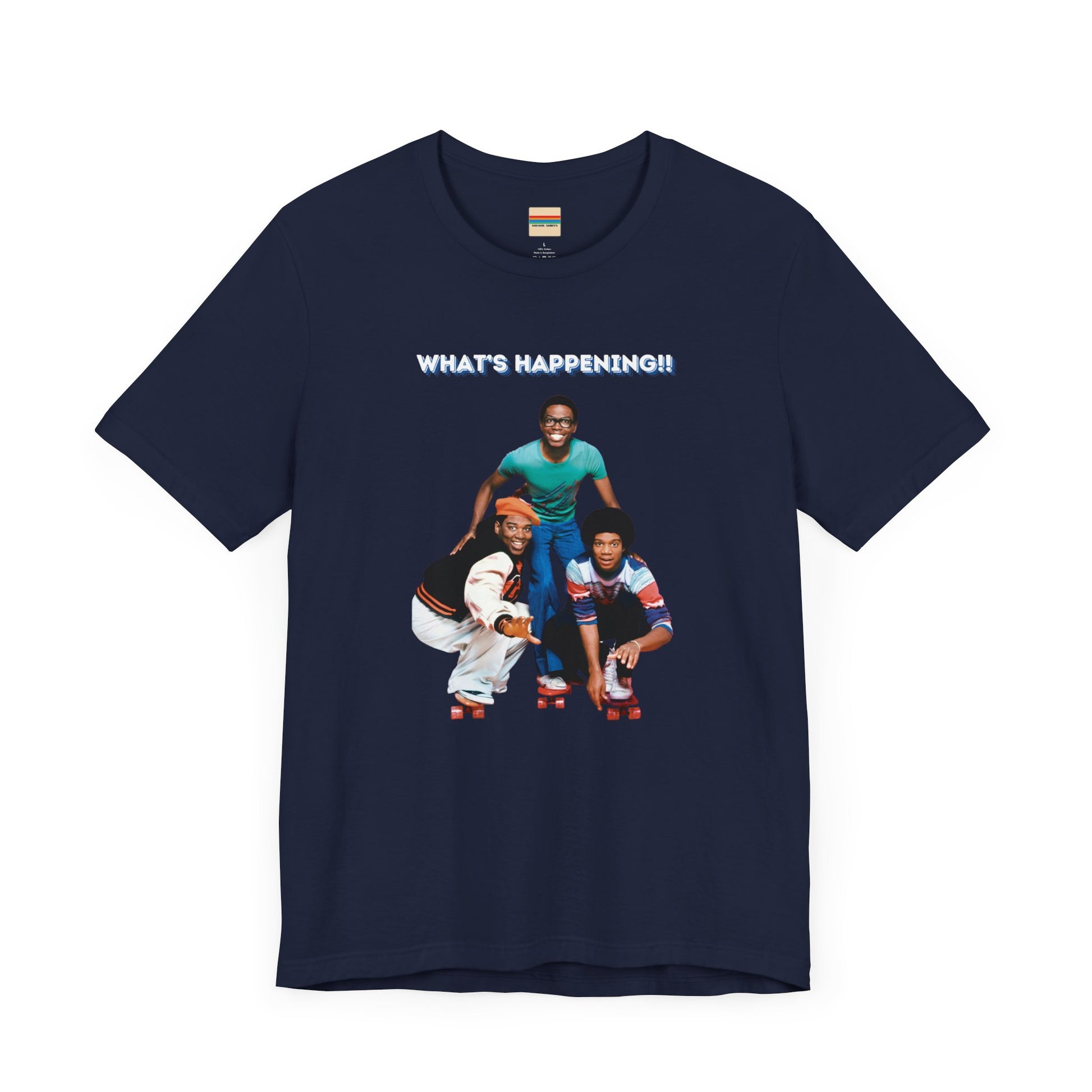 A "What's Happening!!" - Retro 1980s TV Show unisex jersey short sleeve tee by Printify, featuring a blue graphic with three smiling, energetically posing individuals dressed in fashionable casual attire. The top text "WHAT'S HAPPENING!!" is displayed in white, perfectly capturing the nostalgic vibe of the 1980s.