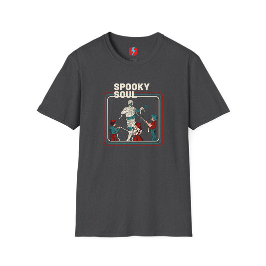 The Spooky Soul - Halloween - Unisex Softstyle T-Shirt by Printify, available in dark gray, showcases a retro-style graphic of a mummy dancing with two kids in Halloween costumes. The text "SPOOKY SOUL" is displayed above the image, which is framed by red and blue lines to enhance its vintage feel.