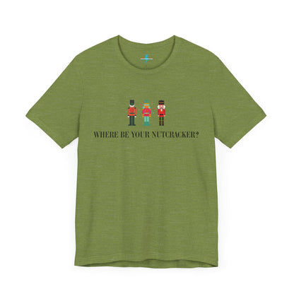 The Printify "Where Be Your Nutcracker? ITYSL T-Shirt" in light gray features three Nutcracker soldiers in festive uniforms, with the text "WHERE BE YOUR NUTCRACKER?" printed in black below the soldiers, making it a perfect holiday shirt.