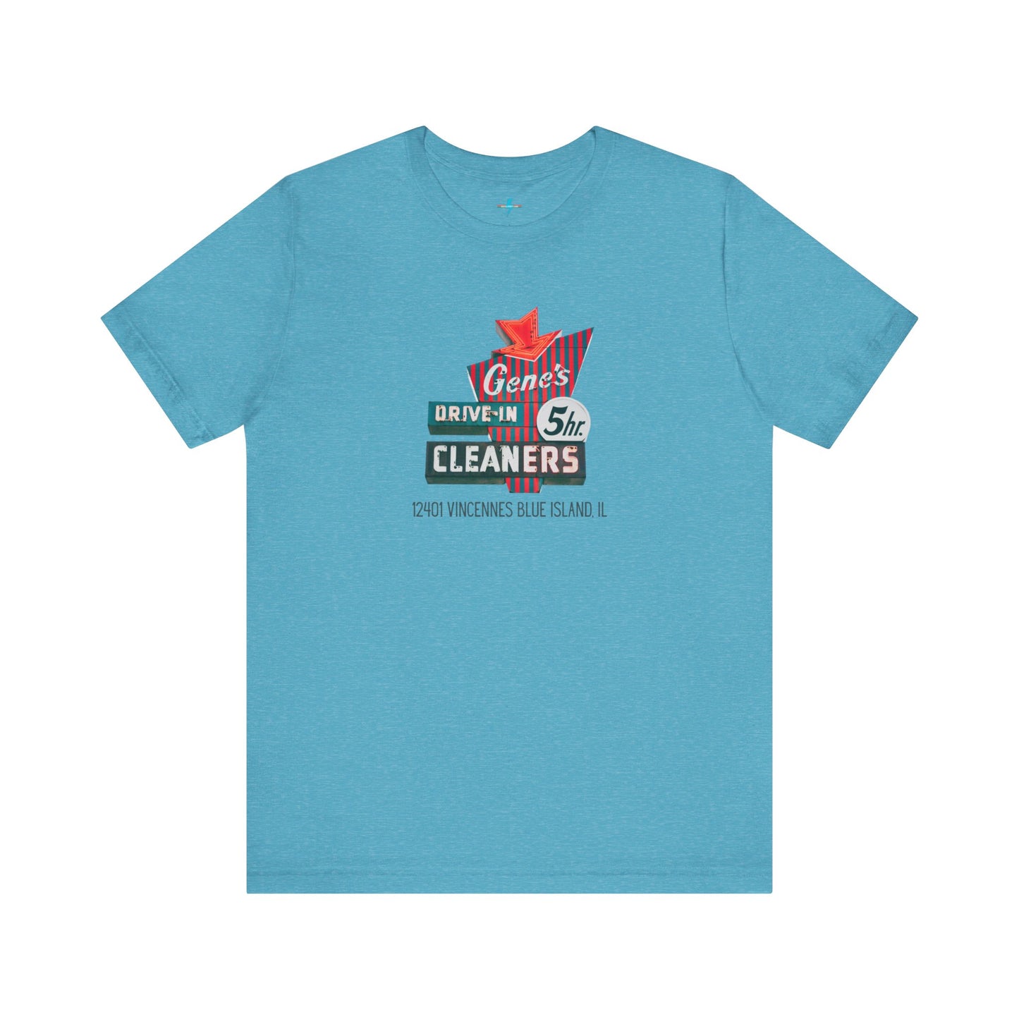 A unisex Jersey short sleeve tee from Printify featuring a light grey color with a retro-style graphic in the center. The design showcases text that reads "Gene's Drive In Cleaners, 5th," along with the address "12401 Vincennes Blue Island IL" in a blend of vintage fonts and colors, evoking the classic Chicago Fire-era vintage sign aesthetic.