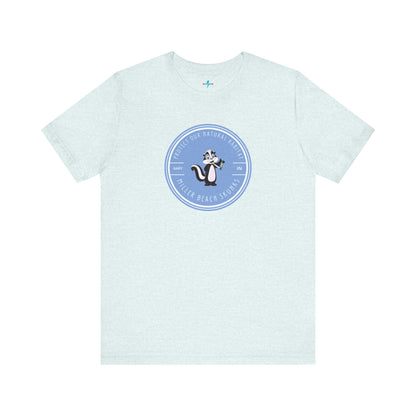 The Printify Miller Beach Skunks - Unisex Jersey Short Sleeve Tee is a gray T-shirt that features a circular blue logo at the center. Inside the logo, there is an illustration of a skunk with the text "Protect Our Habitat" and "Miller Beach Skunks" around the border, promoting environmental consciousness. The upper left part of the logo reads "Gary, IN.