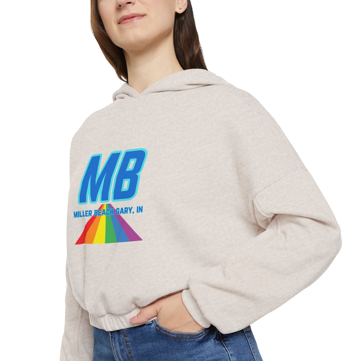 The Women's Cinched Bottom Hoodie from Printify, named "Miller Beach - Unity," is crafted in an oversized light gray design. It features a striking rainbow logo and bold blue "MB" letters on the front, with "MILLER & BARRY, INC." printed below. The casual style of this cotton-polyester blend is further accentuated by a lively triangular pattern.