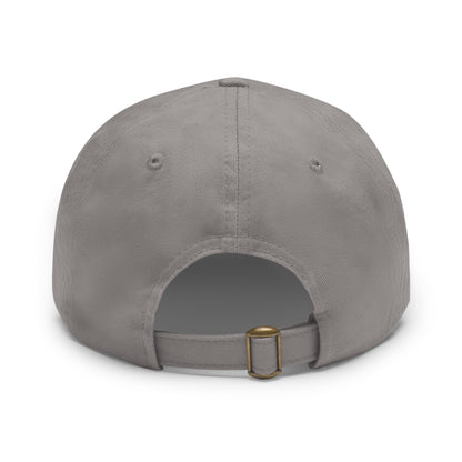 A gray dad hat by Printify, crafted from bio-washed chino twill, featuring a circular blue and white leather patch on the front. The patch showcases a baseball design with "Miller Wiffle" written in cursive font.