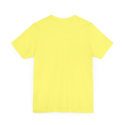 A light yellow unisex jersey short sleeve tee from Printify featuring a blue and yellow checkerboard pattern with a large yellow smiley face in the center. The shirt displays blue text above and below the pattern that reads, "You have to tell me if you're a cop." It's made from 100% Airlume combed and ring-spun cotton.