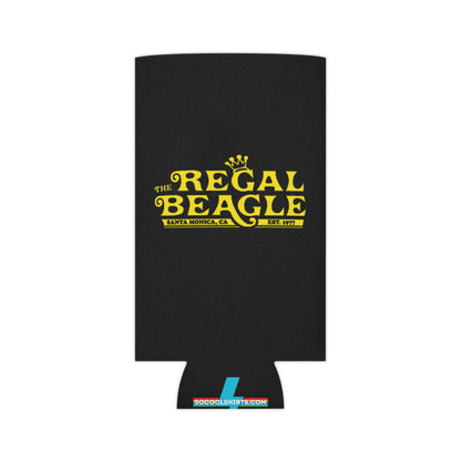 The Regal Beagle - Three's Company - Koozie by Printify features a black design with yellow text that reads "The Regal Beagle," alongside "Santa Monica, CA" and "Est. 1977." A small, partially visible URL in white and blue at the bottom reads socoolshirts.com. An ideal accessory for fans of Three’s Company!