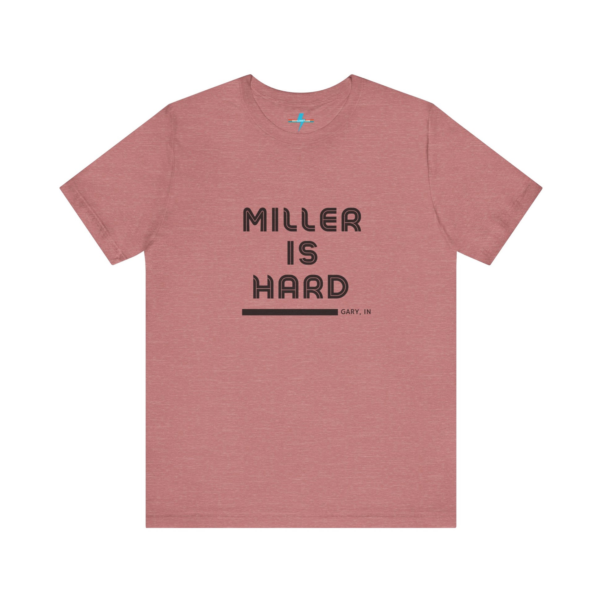 A unisex jersey short sleeve tee from Printify in burnt orange features the bold black text "MILLER IS HARD" on the chest, with "GARY, IN" written beneath in smaller black font. Perfect for showcasing Miller Beach's iconic spirit, this t-shirt is displayed against a plain white background.