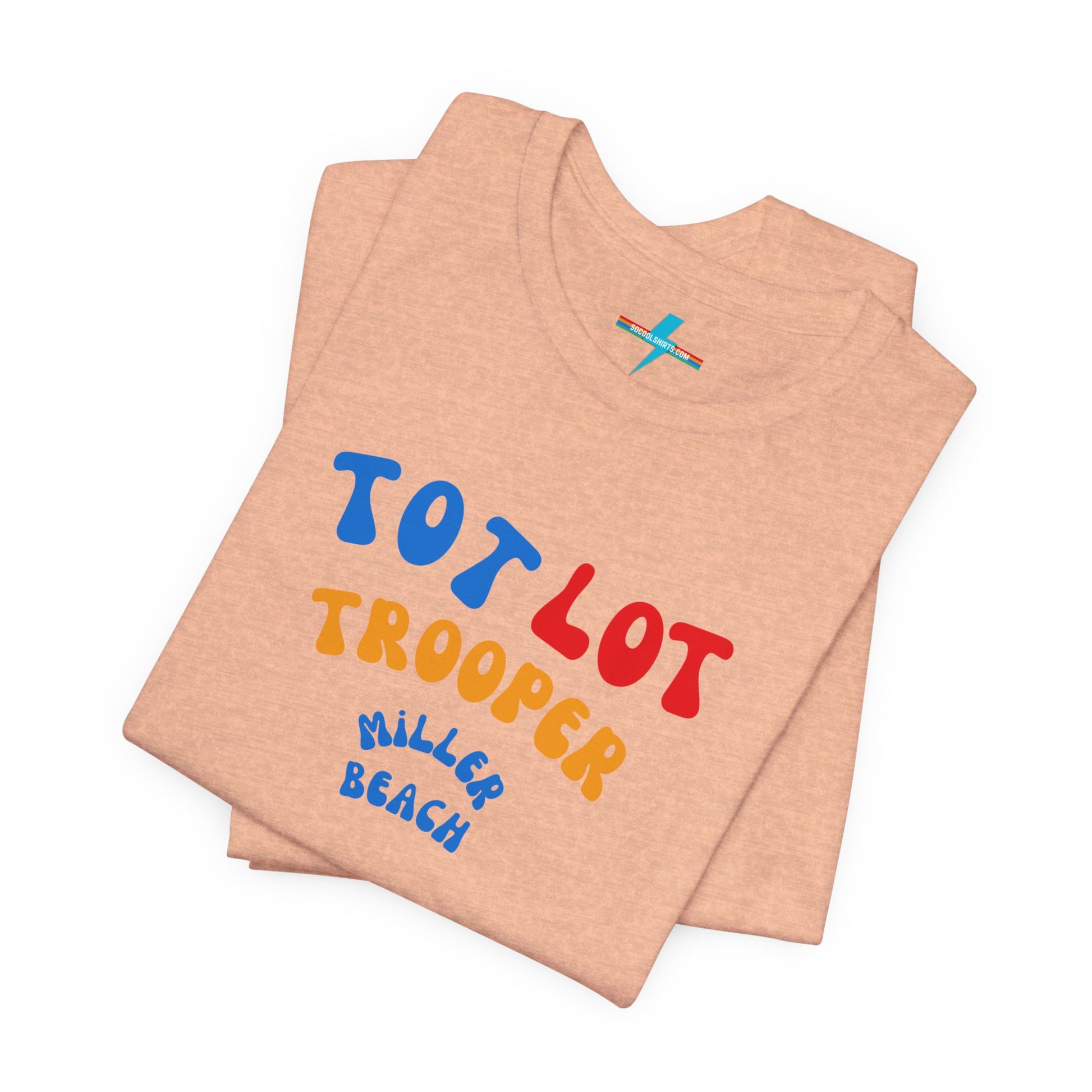 A green unisex jersey short sleeve tee from Printify, featuring colorful text on the front that reads "TOT LOT TROOPER MILLER BEACH" in blue, red, yellow, and orange letters. The shirt is displayed against a plain white background.