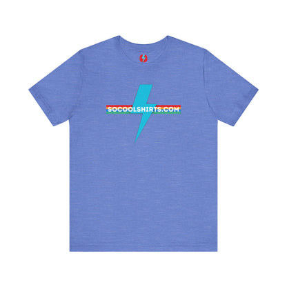 This unisex jersey short sleeve tee by Printify features a striking maroon color with a central light blue lightning bolt design. The text "SOCOOLSHIRTS.COM" is prominently displayed across the lightning bolt in white letters, set against a multicolored background that exudes retro vibes. The shirt is shown laid flat on a white backdrop.