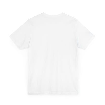 A light blue Printify "The Tinder Box 1980s" unisex jersey short sleeve tee featuring the "Tinder Box" logo in the center. The logo consists of a dark shield with the words "Tinder Box" in white text, with a small flame icon replacing the dot above the "i".