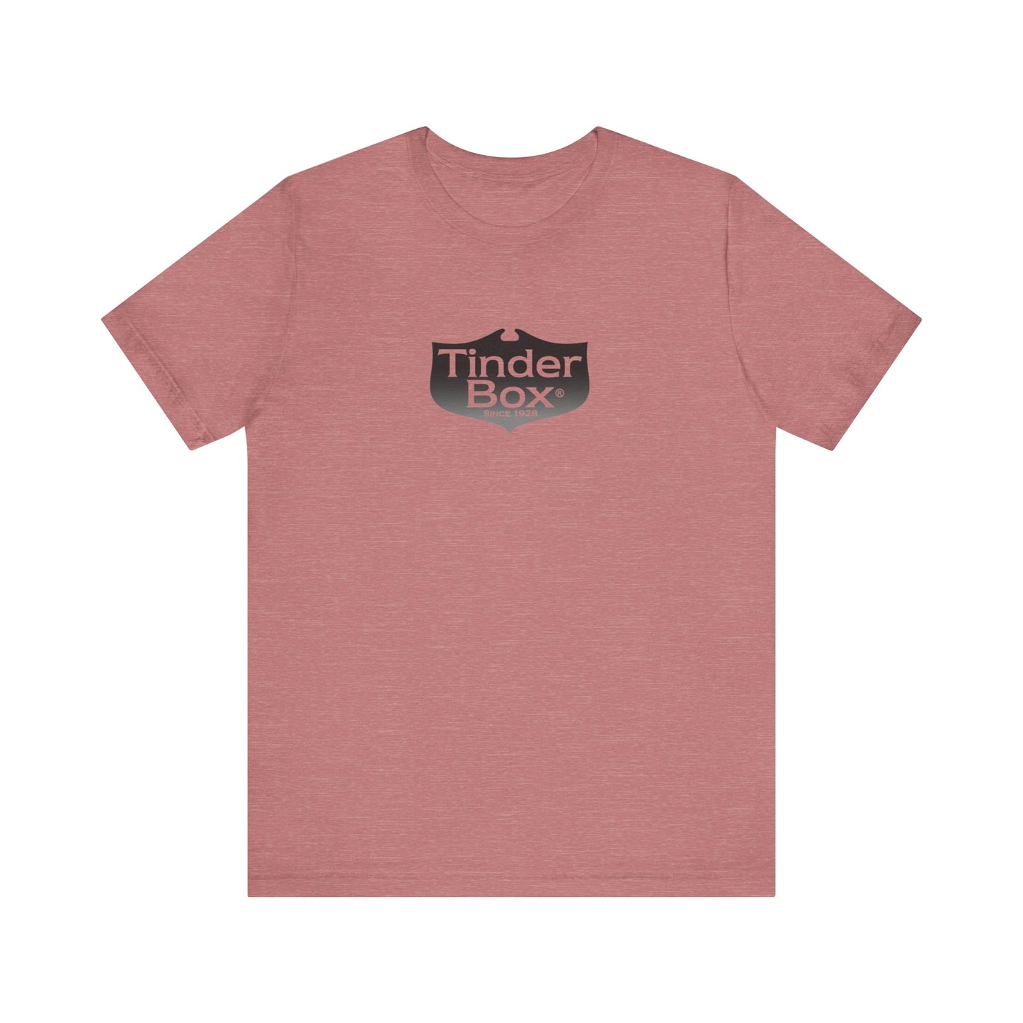 A light blue Printify "The Tinder Box 1980s" unisex jersey short sleeve tee featuring the "Tinder Box" logo in the center. The logo consists of a dark shield with the words "Tinder Box" in white text, with a small flame icon replacing the dot above the "i".