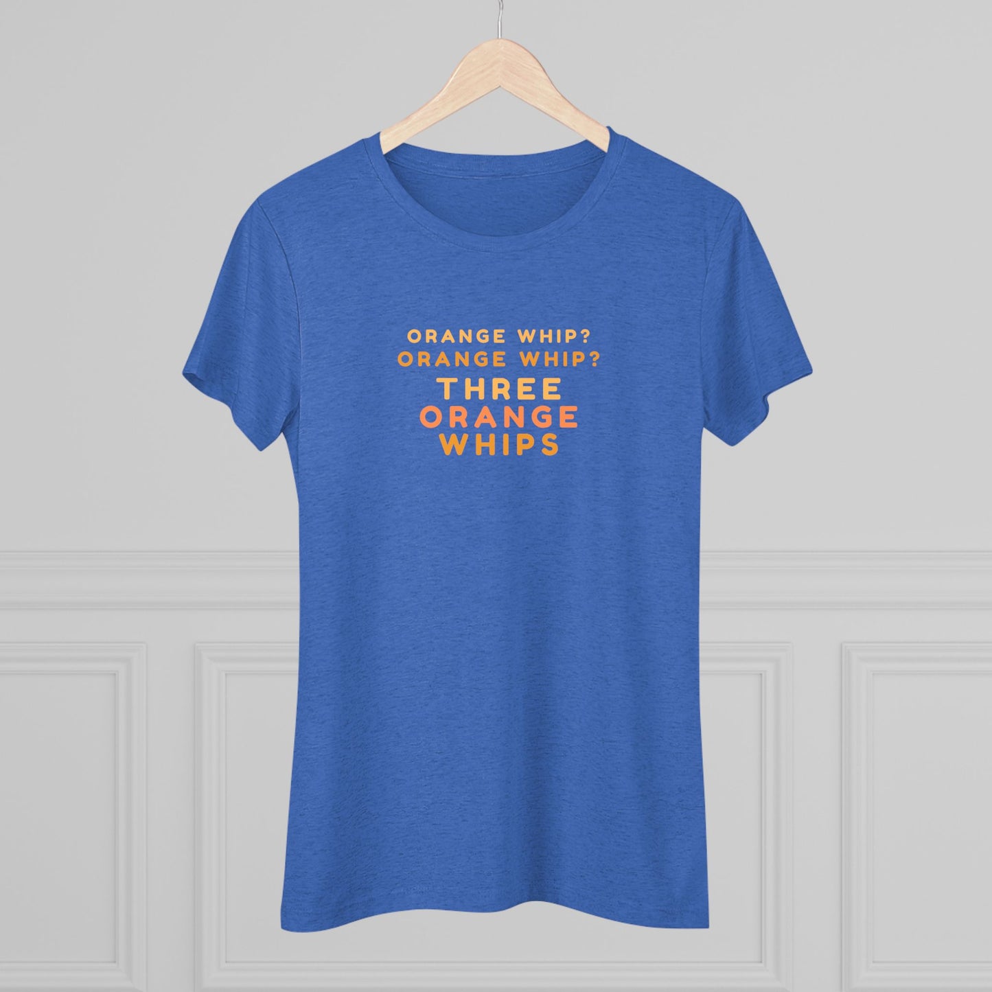 This Blues Brothers women's triblend tee from Printify features a dark gray vintage look with the text "ORANGE WHIP? ORANGE WHIP? THREE ORANGE WHIPS" printed in bright orange and yellow in the center. With a round neck and short sleeves, it's perfect for that retro vibe.