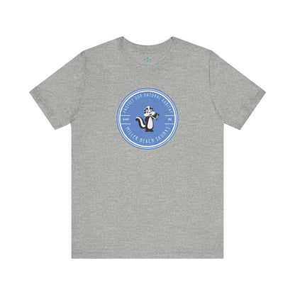 The Printify Miller Beach Skunks - Unisex Jersey Short Sleeve Tee is a gray T-shirt that features a circular blue logo at the center. Inside the logo, there is an illustration of a skunk with the text "Protect Our Habitat" and "Miller Beach Skunks" around the border, promoting environmental consciousness. The upper left part of the logo reads "Gary, IN.