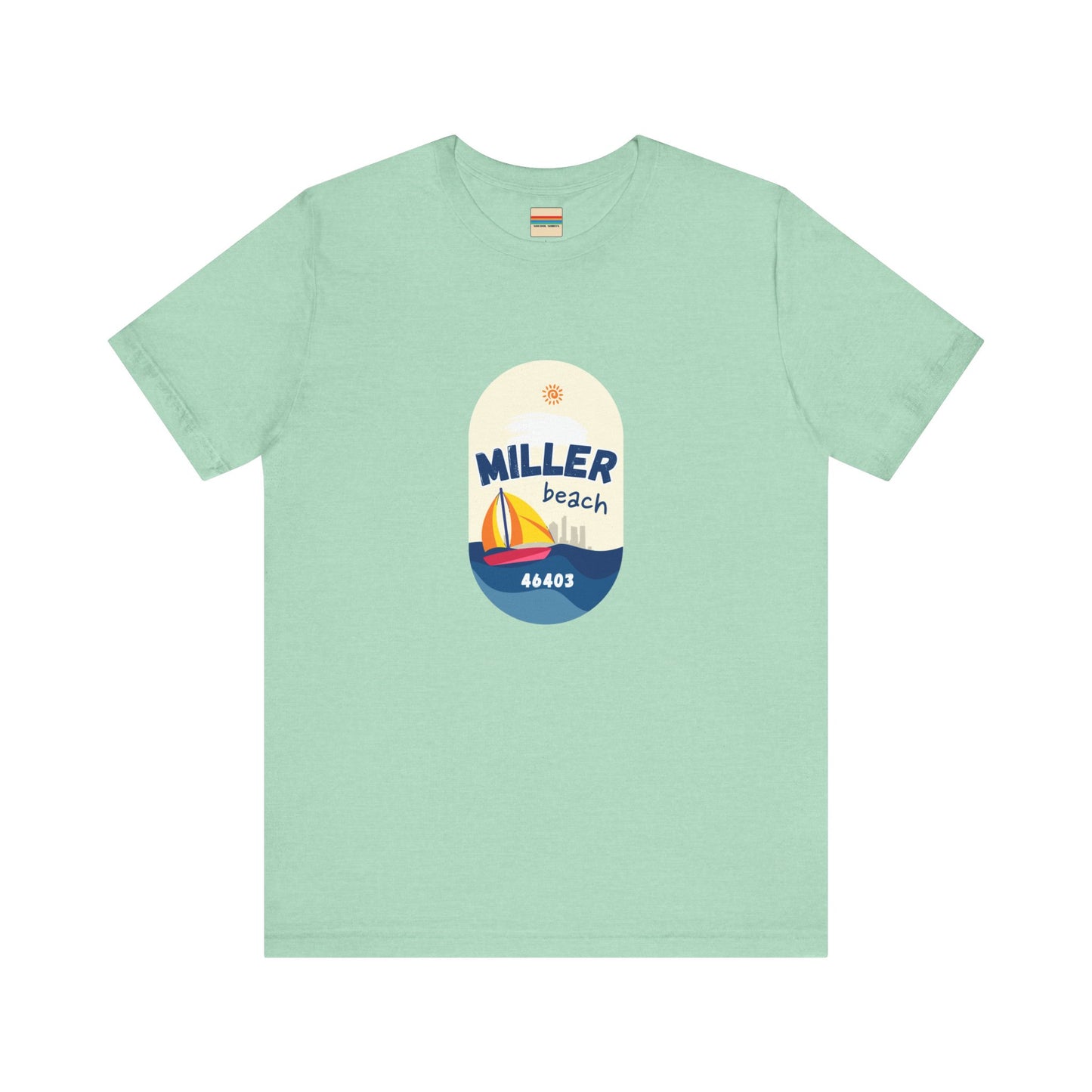 The Miller Beach Sailboat - Unisex Jersey Short Sleeve Tee by Printify features a vibrant graphic design portraying a sailboat on water with a sun above it and the text "MILLER beach 46403." This white retail fit shirt is crafted from soft Airlume combed cotton and showcases rounded graphics in blue, orange, and yellow.