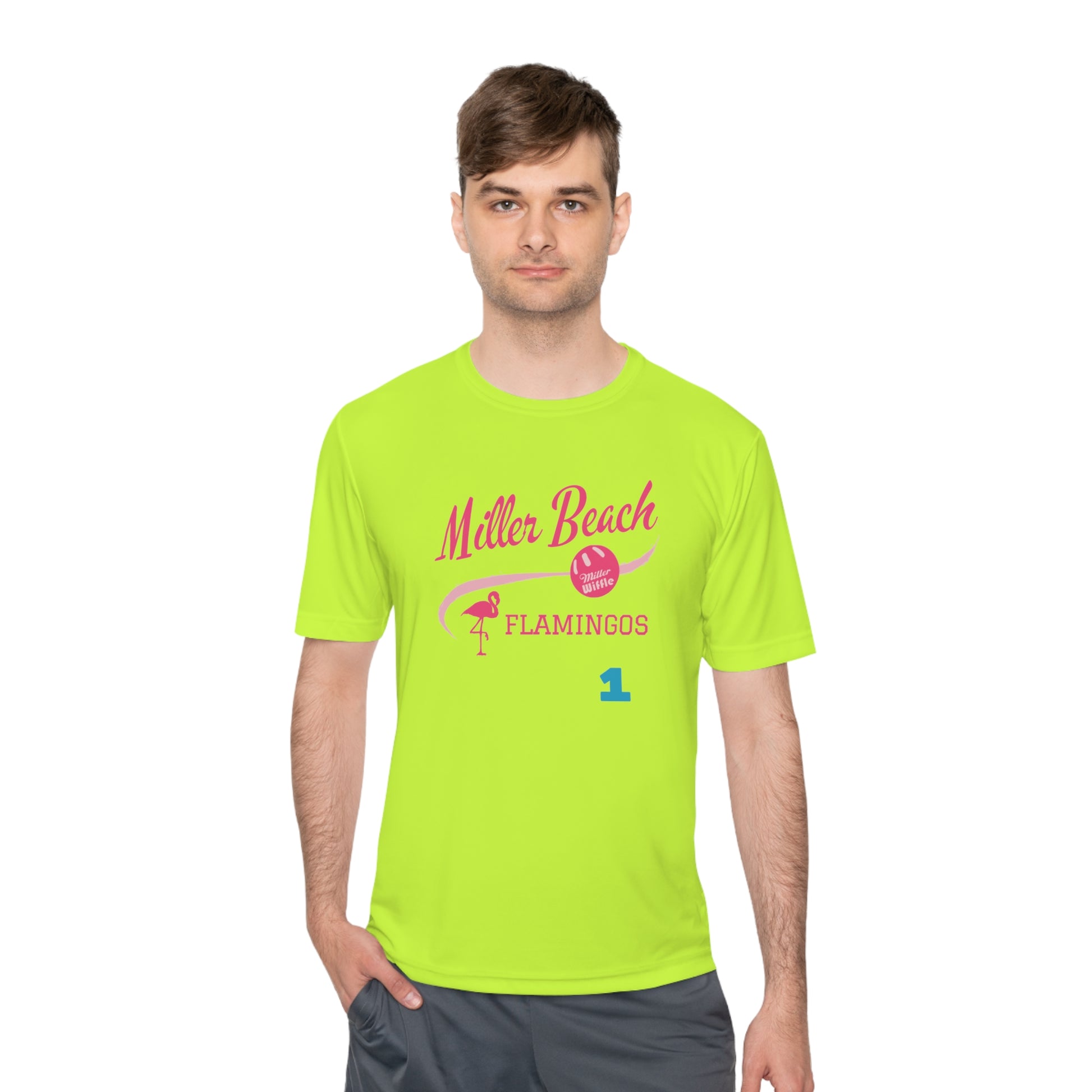 Introducing the "Miller Beach Flamingos - Jackson 01" Unisex Moisture Wicking Tee by Printify. This beige T-shirt showcases "Miller Beach" in a pink cursive font accompanied by a small pink flamingo illustration. Below, "FLAMINGOS" is displayed in bold pink capital letters, with a blue "01" on the bottom right corner. As part of the Sport-Tek PosiCharge Competitor collection, this lightweight shirt provides superior moisture-wicking performance.