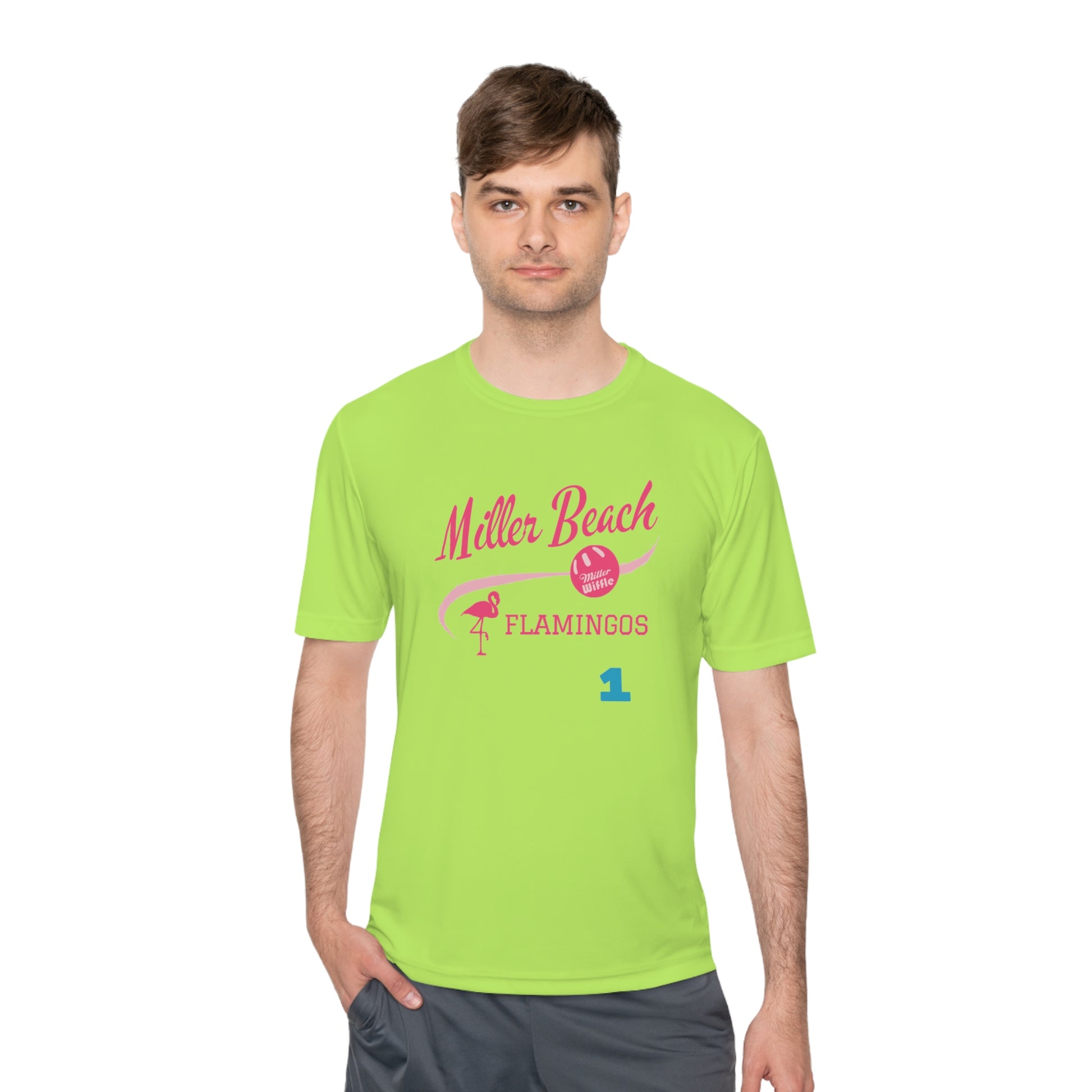 Introducing the "Miller Beach Flamingos - Jackson 01" Unisex Moisture Wicking Tee by Printify. This beige T-shirt showcases "Miller Beach" in a pink cursive font accompanied by a small pink flamingo illustration. Below, "FLAMINGOS" is displayed in bold pink capital letters, with a blue "01" on the bottom right corner. As part of the Sport-Tek PosiCharge Competitor collection, this lightweight shirt provides superior moisture-wicking performance.