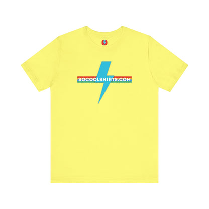 This unisex jersey short sleeve tee by Printify features a striking maroon color with a central light blue lightning bolt design. The text "SOCOOLSHIRTS.COM" is prominently displayed across the lightning bolt in white letters, set against a multicolored background that exudes retro vibes. The shirt is shown laid flat on a white backdrop.