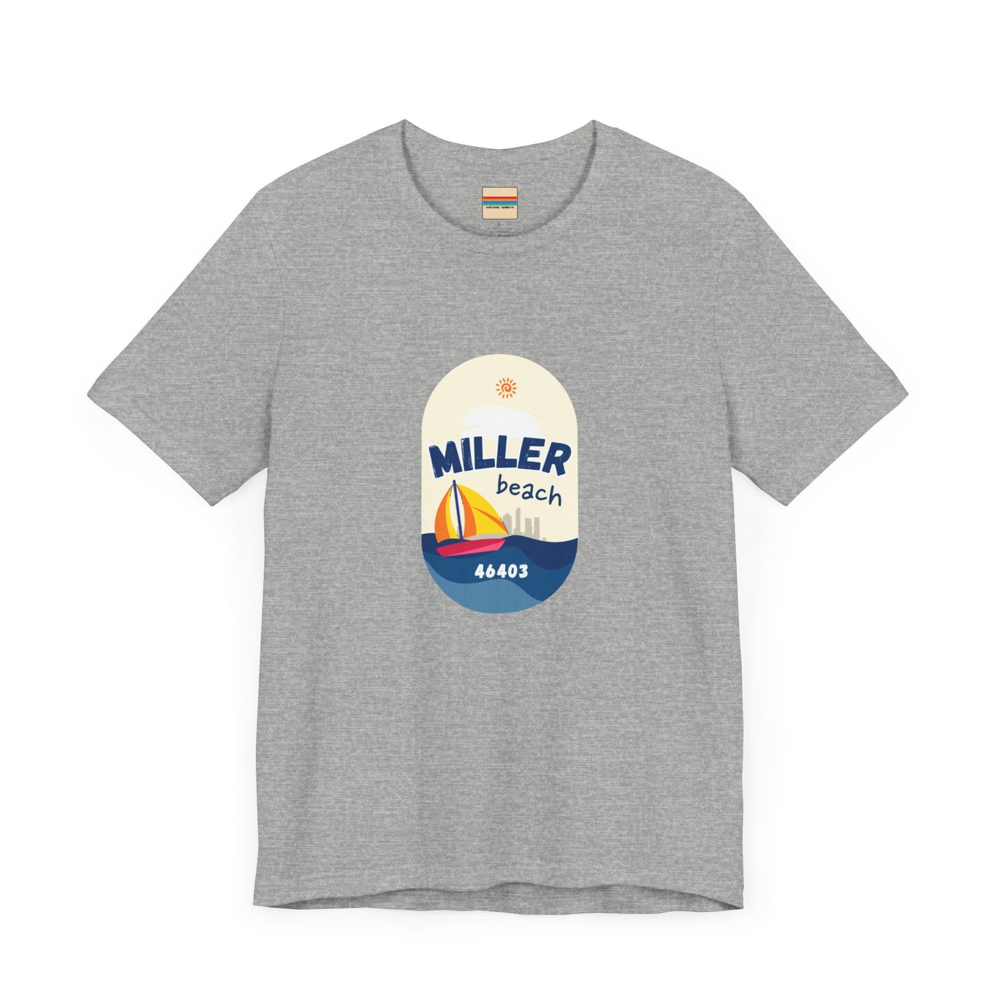 The Miller Beach Sailboat - Unisex Jersey Short Sleeve Tee by Printify features a vibrant graphic design portraying a sailboat on water with a sun above it and the text "MILLER beach 46403." This white retail fit shirt is crafted from soft Airlume combed cotton and showcases rounded graphics in blue, orange, and yellow.