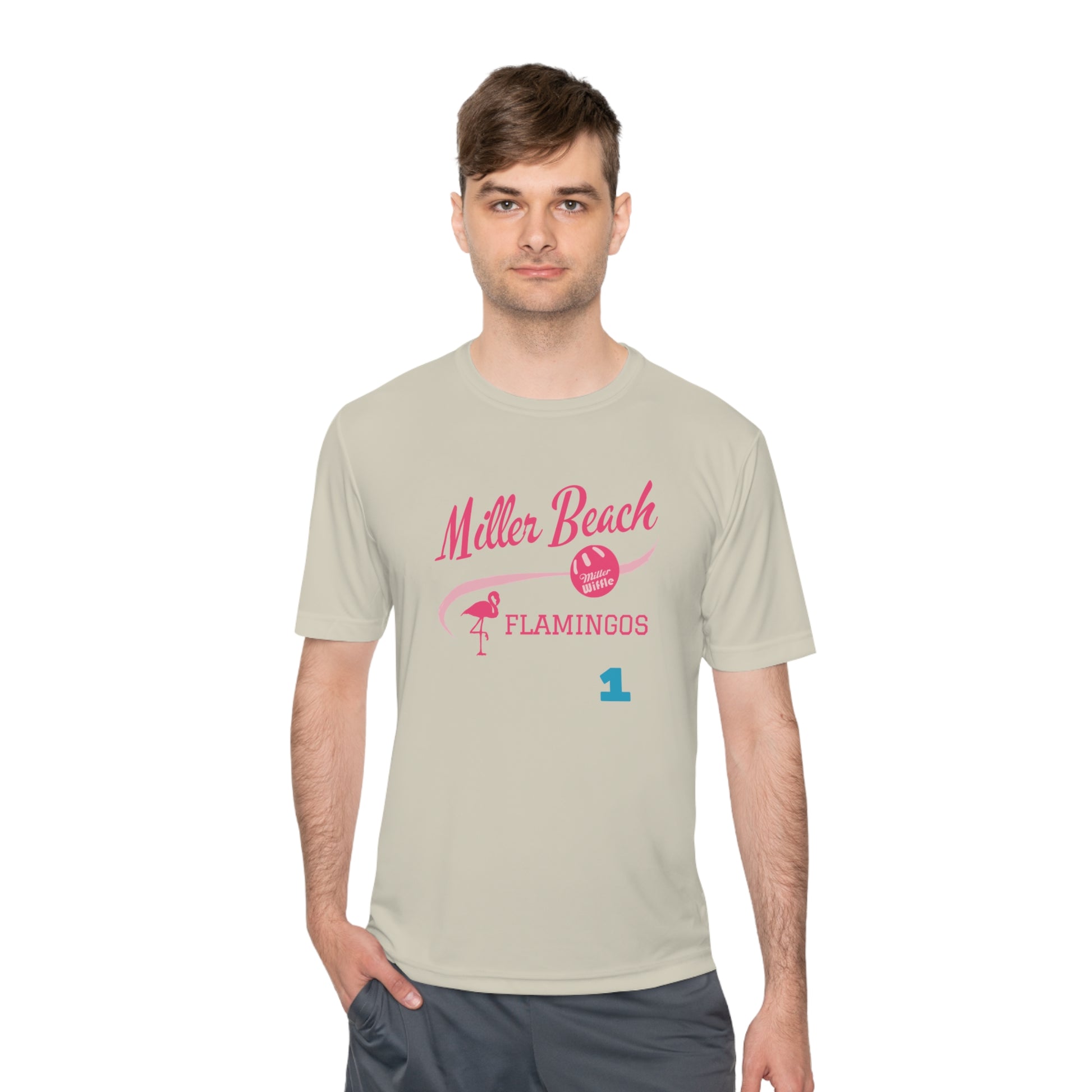 Introducing the "Miller Beach Flamingos - Jackson 01" Unisex Moisture Wicking Tee by Printify. This beige T-shirt showcases "Miller Beach" in a pink cursive font accompanied by a small pink flamingo illustration. Below, "FLAMINGOS" is displayed in bold pink capital letters, with a blue "01" on the bottom right corner. As part of the Sport-Tek PosiCharge Competitor collection, this lightweight shirt provides superior moisture-wicking performance.
